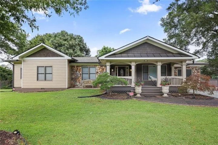 Craftsman house featuring a porch, crawl space, and a front yard