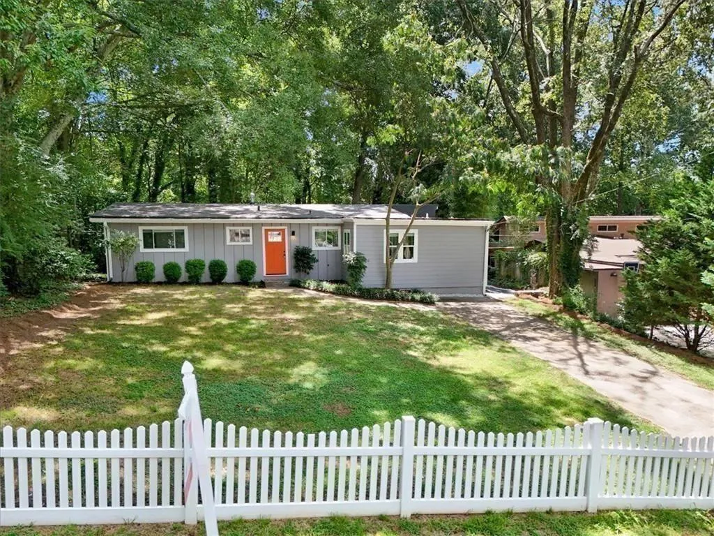 Flat grassy front yard perfect for pets and play