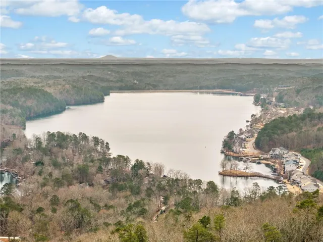 Aerial view of property's location featuring a large body of water