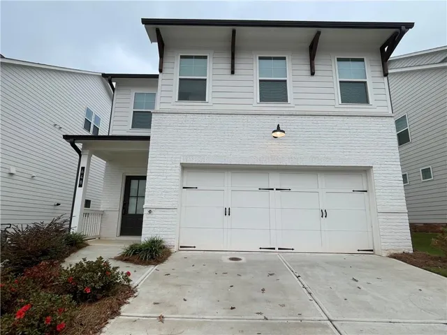View of front of property featuring a garage