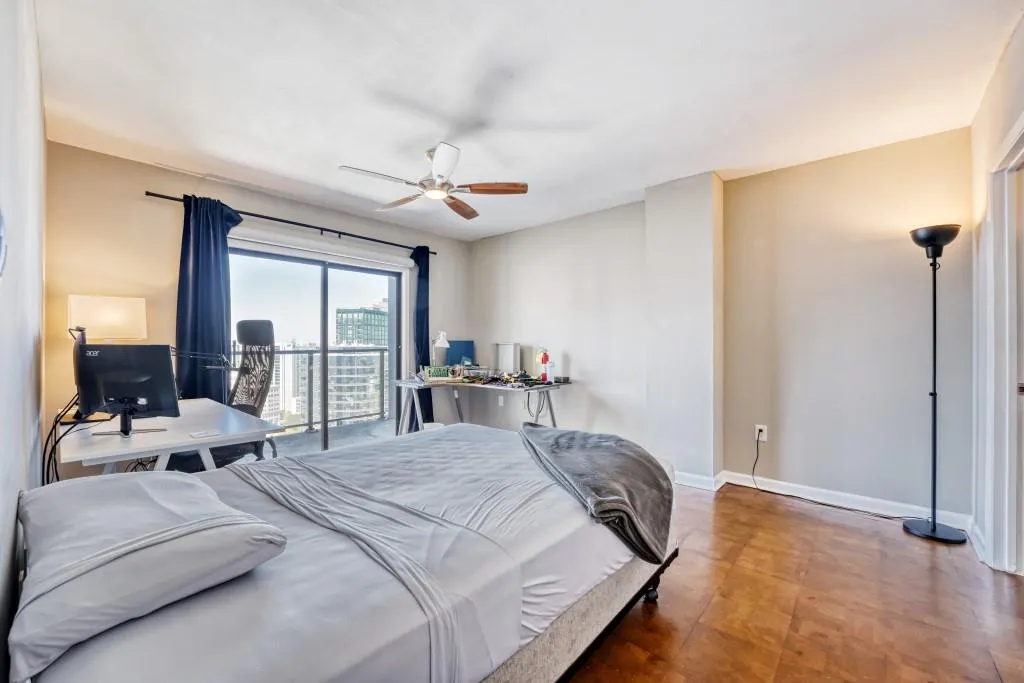 Bedroom featuring access to outside and ceiling fan