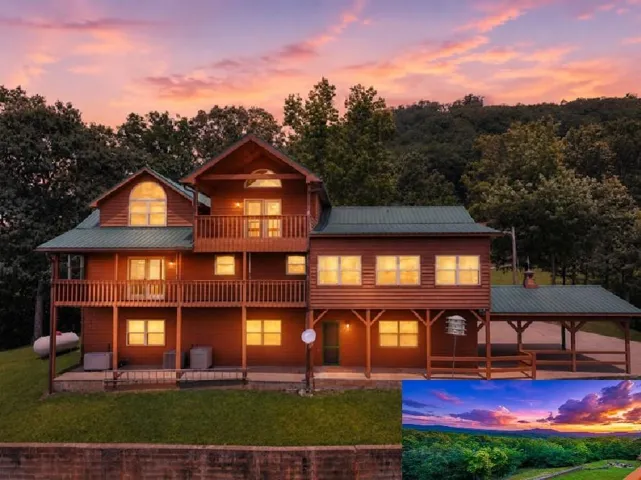Multi-level cabin-style residence featuring natural wood siding and a green metal roof