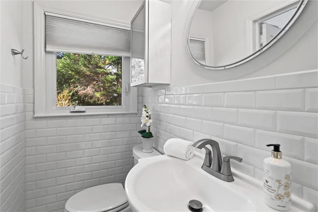 Half bath with tile walls