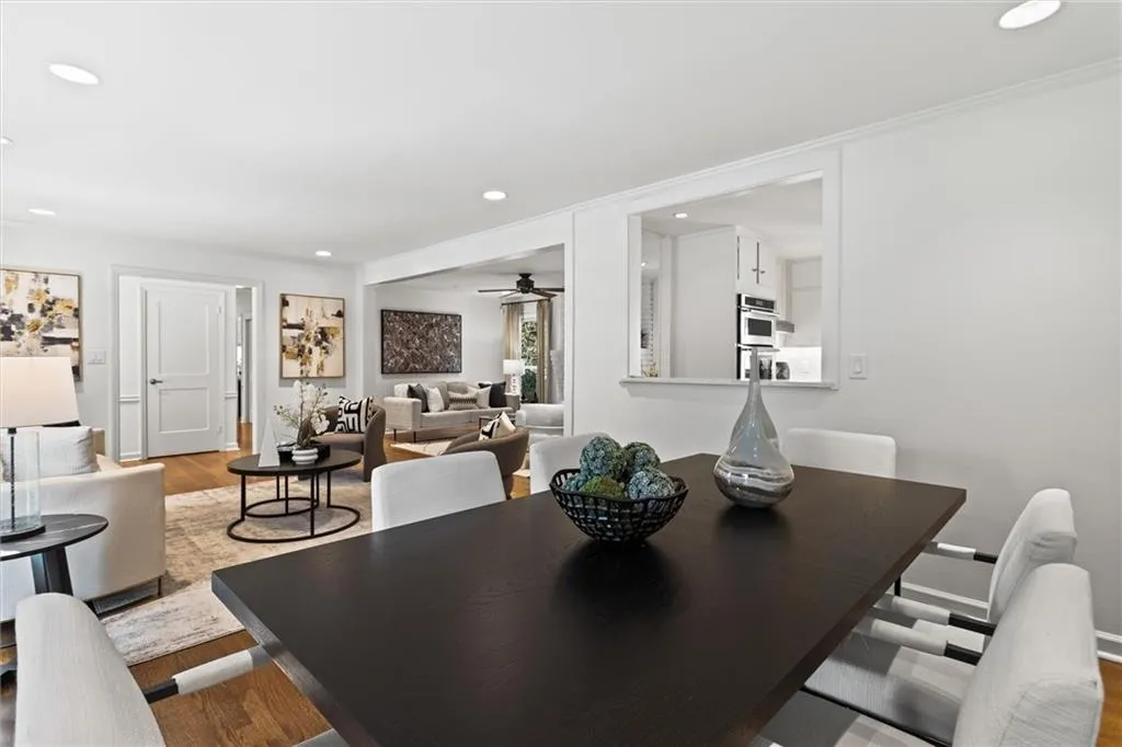 Dining room featuring wood finished floors, recessed lighting, and a ceiling fan