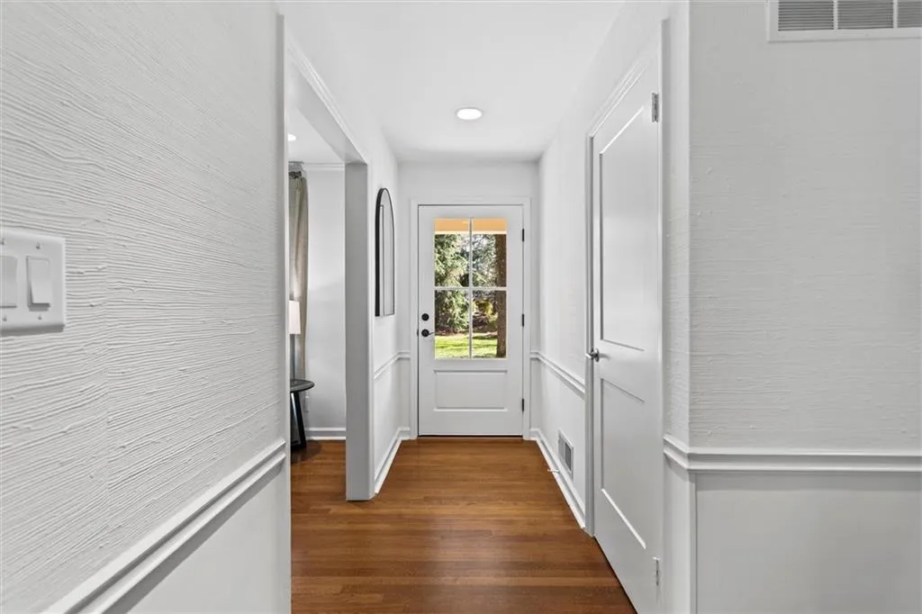 Doorway to outside featuring wood finished floors and recessed lighting