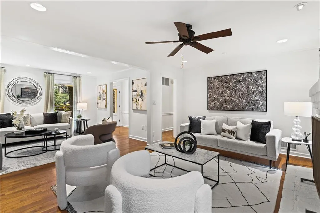 Living area with wood finished floors, recessed lighting, and ceiling fan