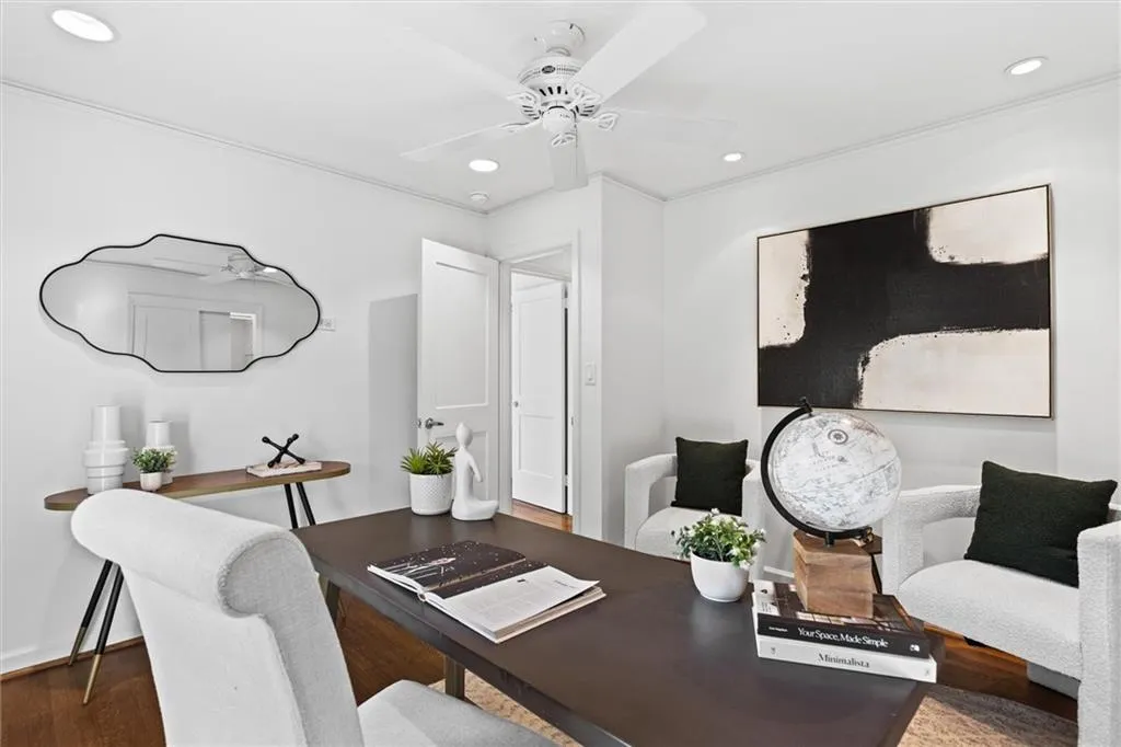 Office area featuring wood finished floors, recessed lighting, crown molding, and a ceiling fan