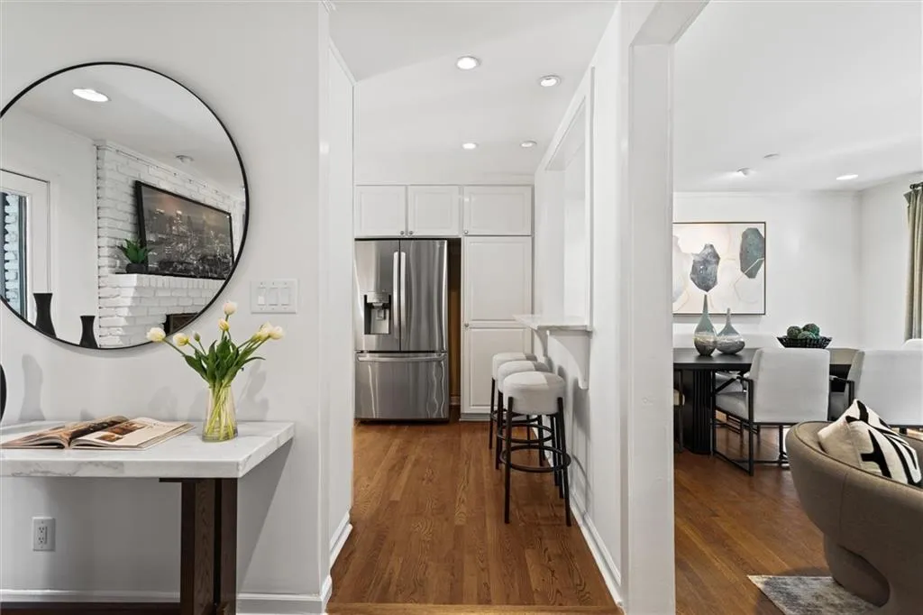 Hallway featuring dark wood-type flooring and recessed lighting