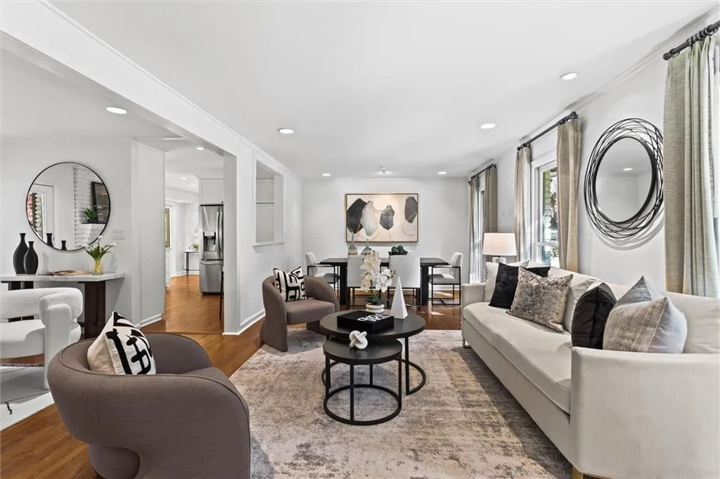 Living room with wood finished floors and recessed lighting
