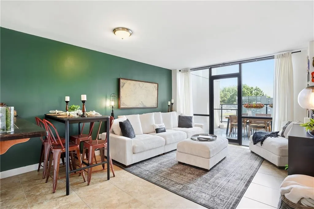 Spacious living area with floor to ceiling windows