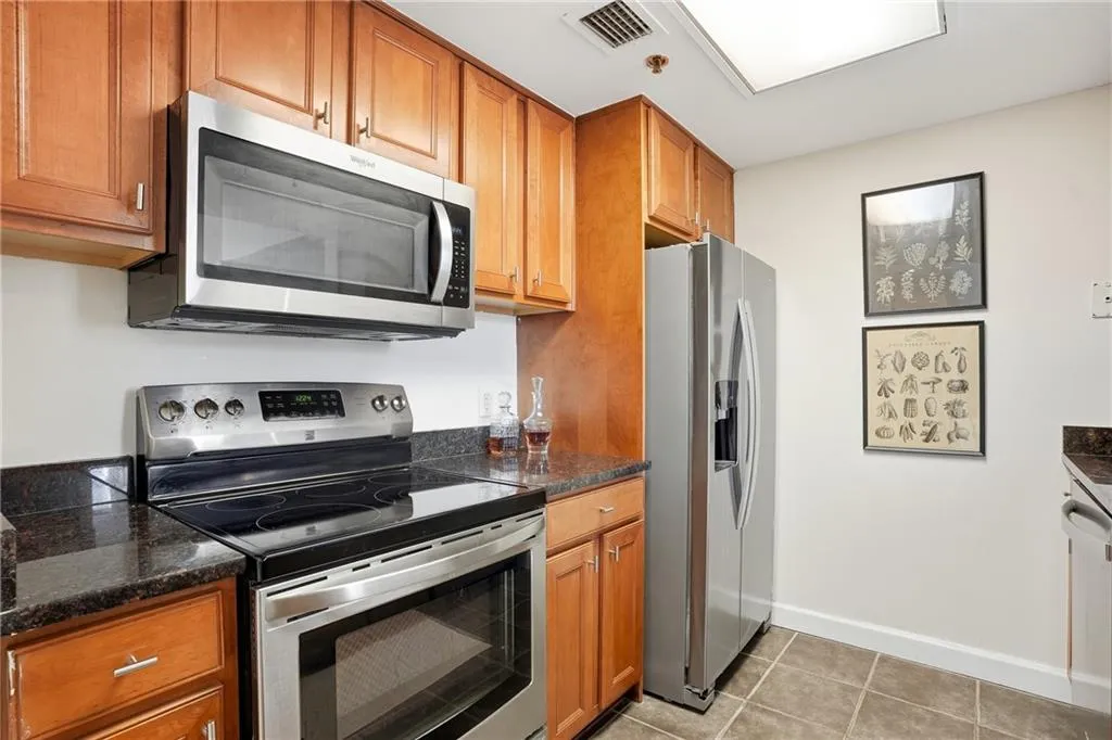 Kitchen with stainless steel appliance