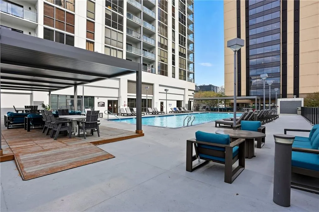 Community pool with a patio area