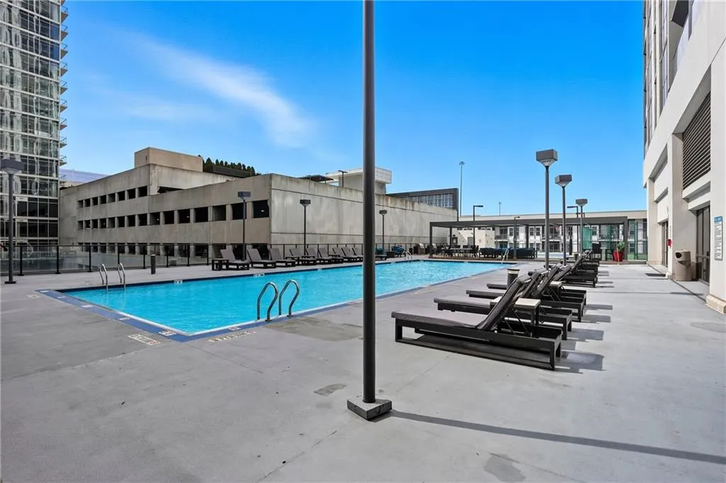 Community pool with a patio area