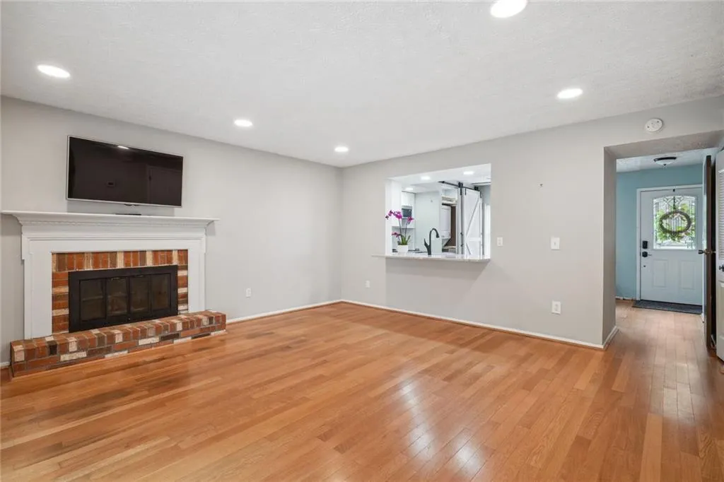 featuring a brick fireplace