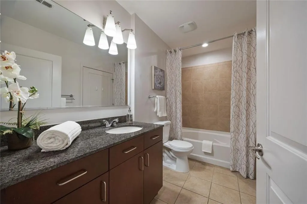 Your ensuite bath has another door to the hall-per