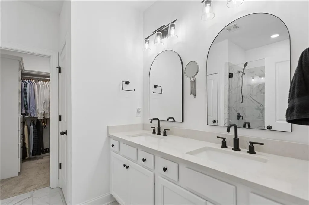 Primary bath with two sinks and oversized shower