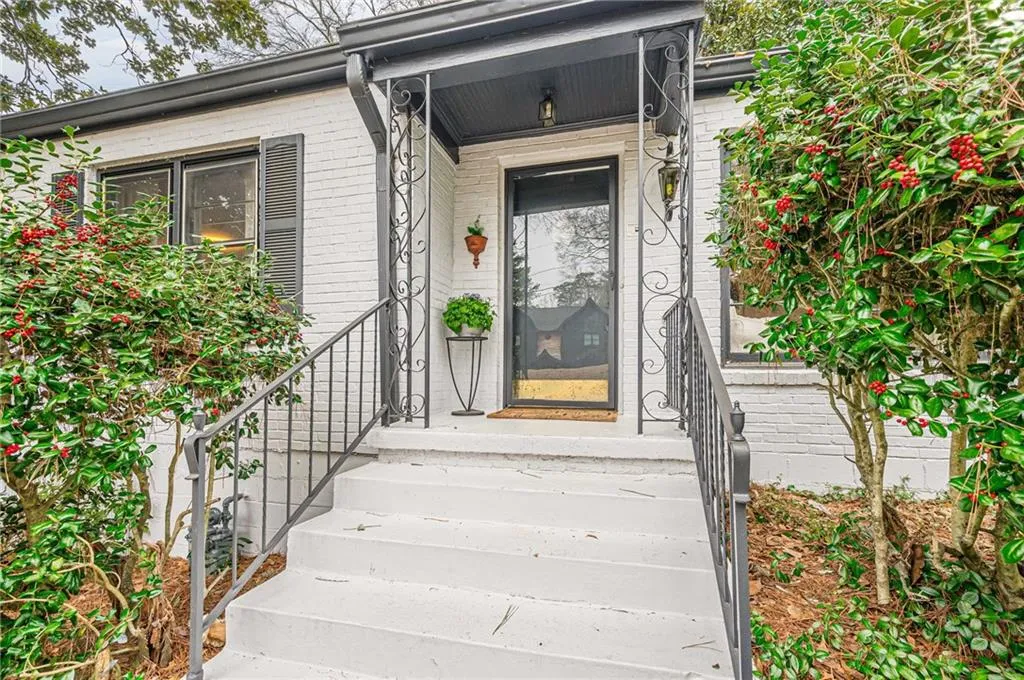 Property entrance featuring brick siding