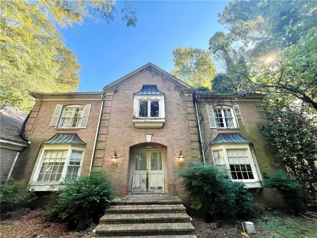 View of front of house featuring brick siding