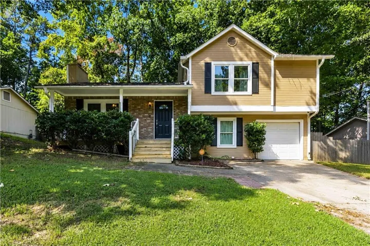 Two-story exterior with horizontal siding and brick accents