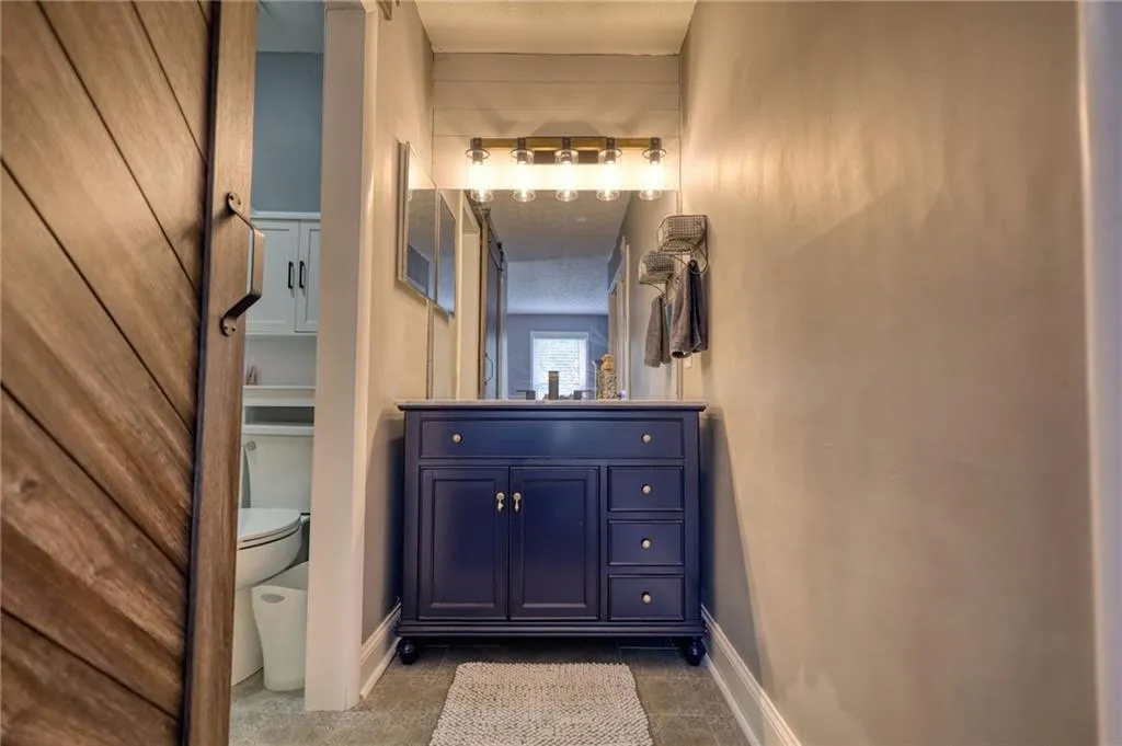 Bathroom featuring vanity and baseboards