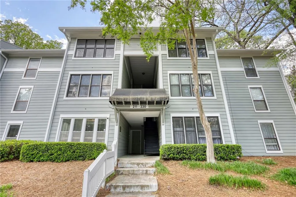 View of front of house featuring a balcony