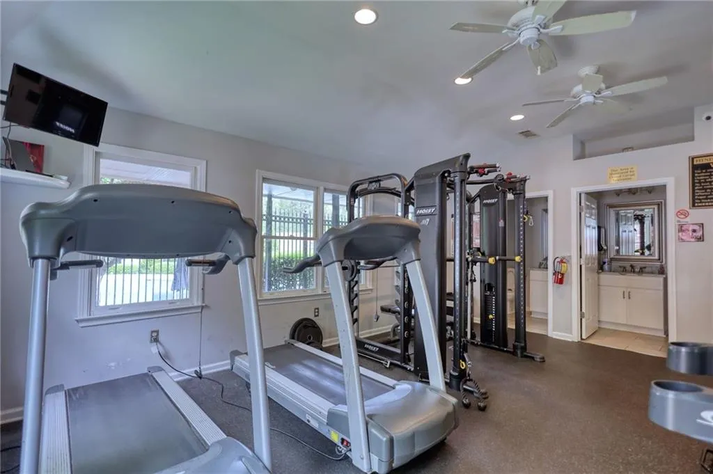 Gym with recessed lighting and ceiling fan