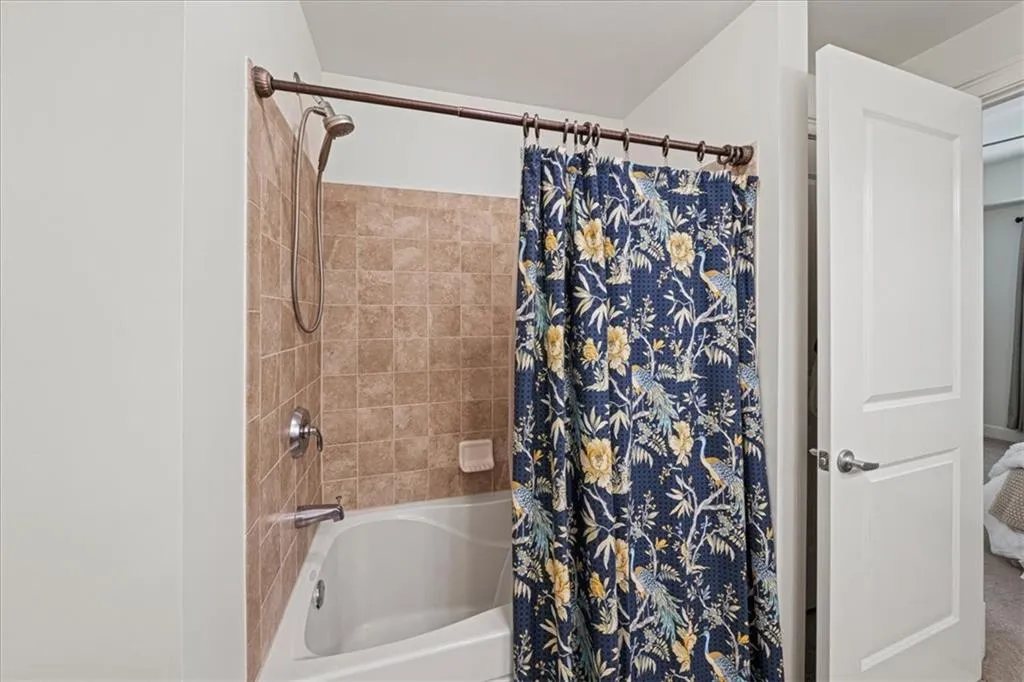 Bathroom featuring shower / tub combo