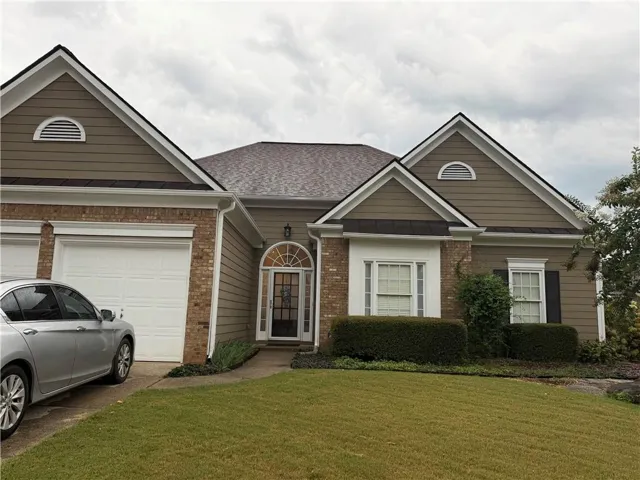 Brick and siding exterior with gabled roof lines