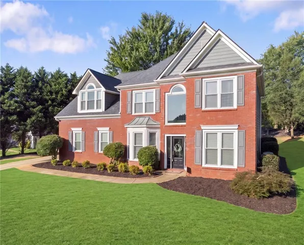 Brick exterior with gray siding accents