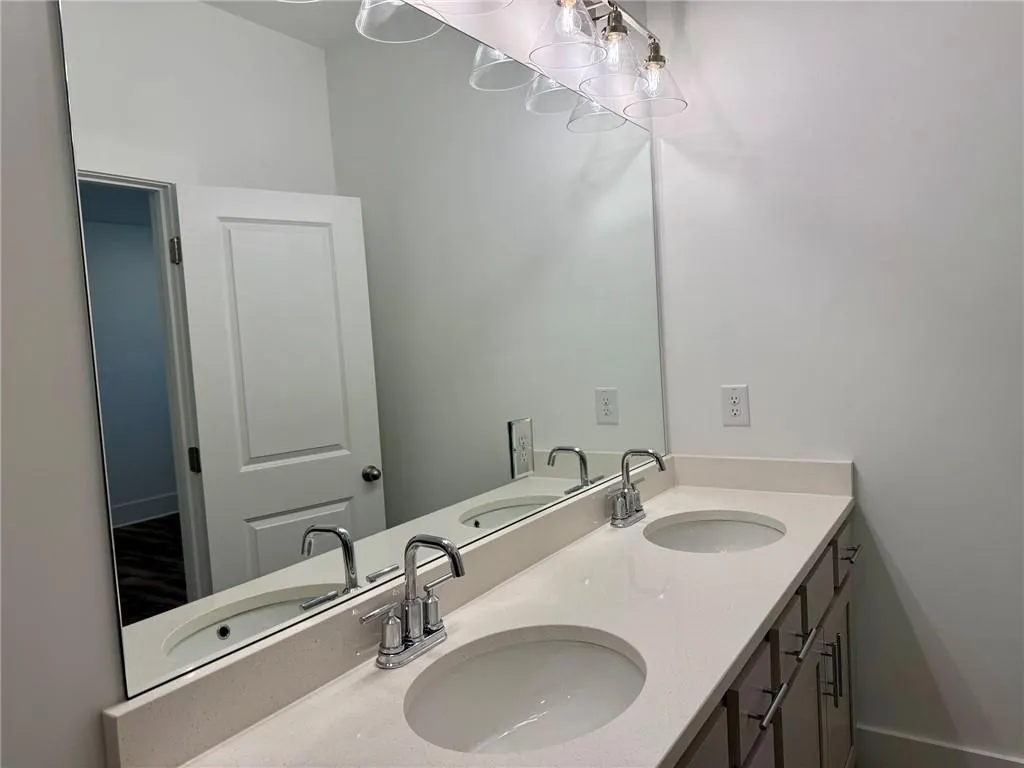 Dual vanities at the Primary bath.  Example of design finishes planned for the home.