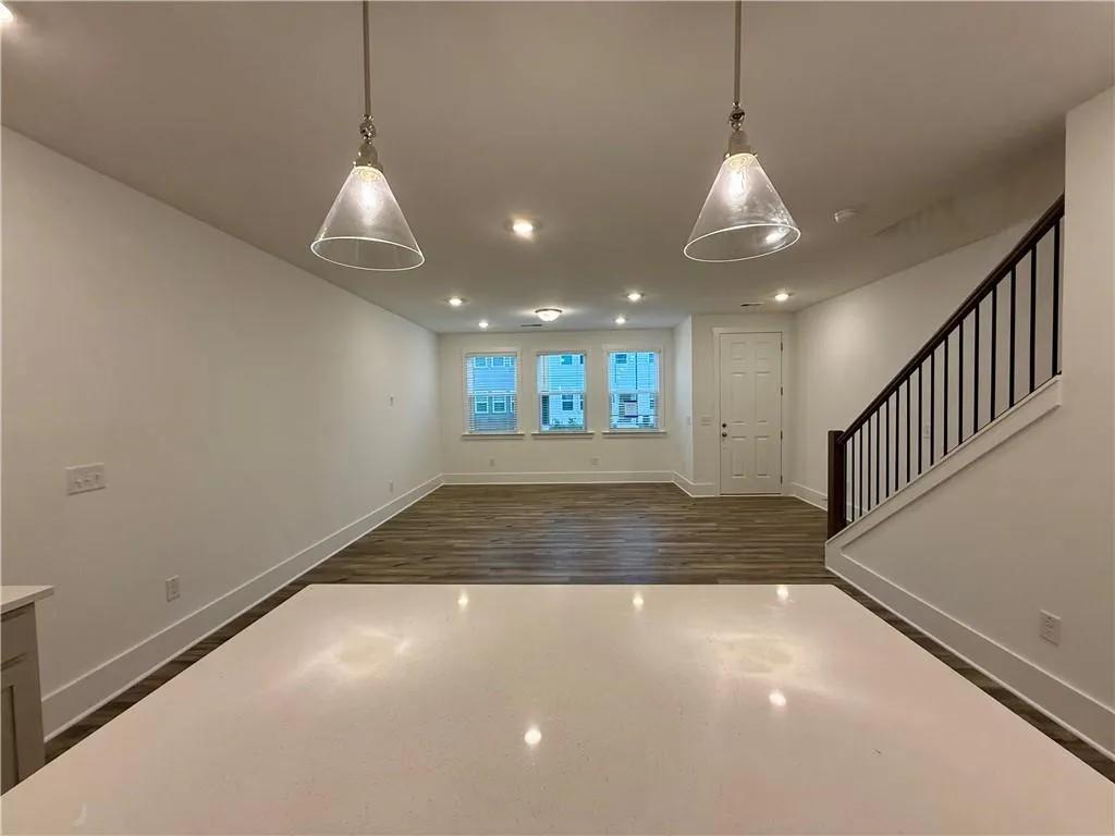View from kitchen to dining & Family room. Example of design finishes planned for the home.