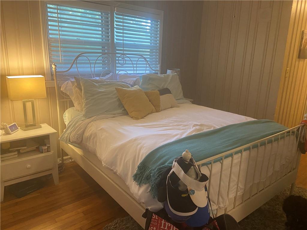 Bedroom with wood-type flooring
