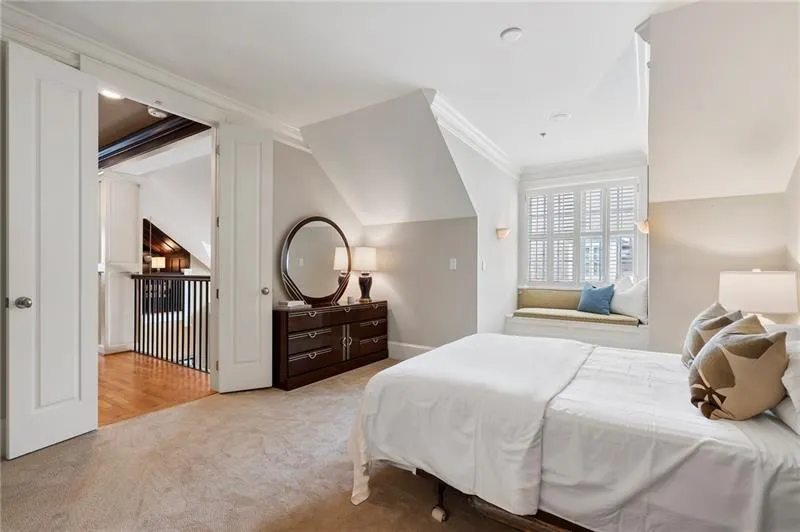Bedroom featuring ornamental molding, carpet floors, and baseboards
