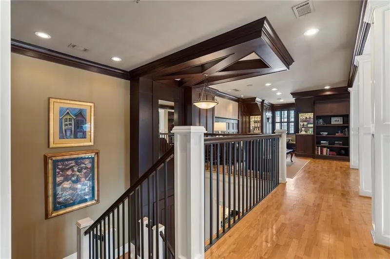 Hallway featuring recessed lighting, an upstairs landing, visible vents, light wood-style flooring, and ornamental molding