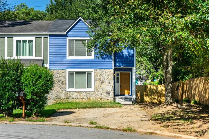 Blue horizontal siding exterior with stone veneer accents
