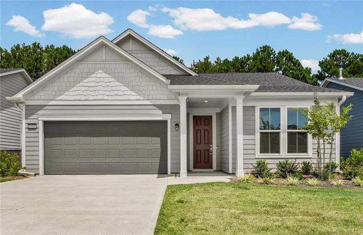 Single-story residence featuring a gray exterior with horizontal siding and shake accents