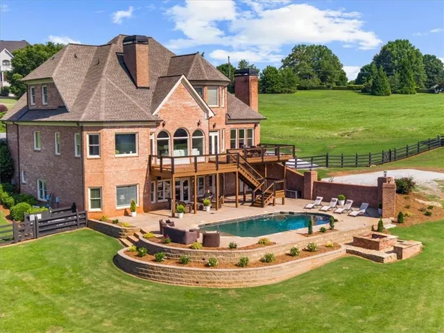 Fabulous entertaining spaces in this 4 side brick home with pool