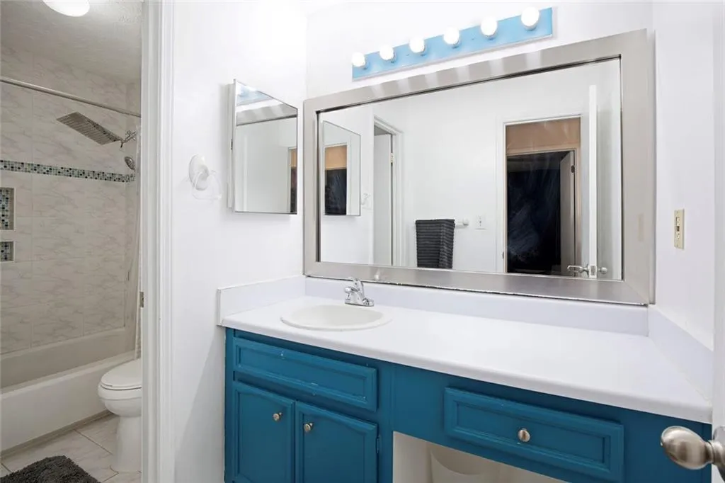 Full bath with private shower area