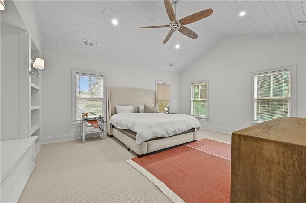 Bedroom with recessed lighting, light carpet, a ceiling fan, high vaulted ceiling, and wood ceiling
