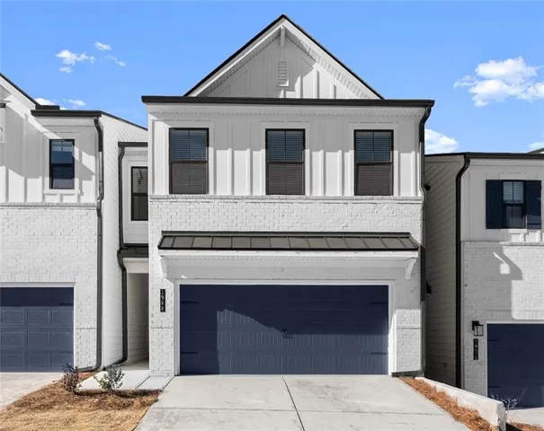View of front of property featuring a garage