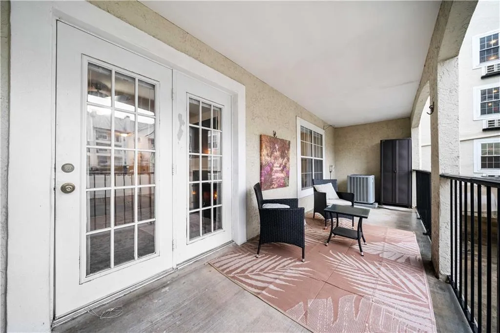 Balcony featuring french doors