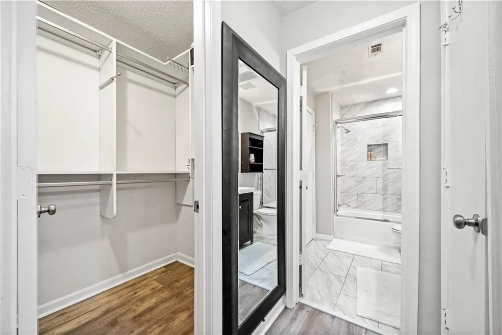 Spacious closet with wood-type flooring