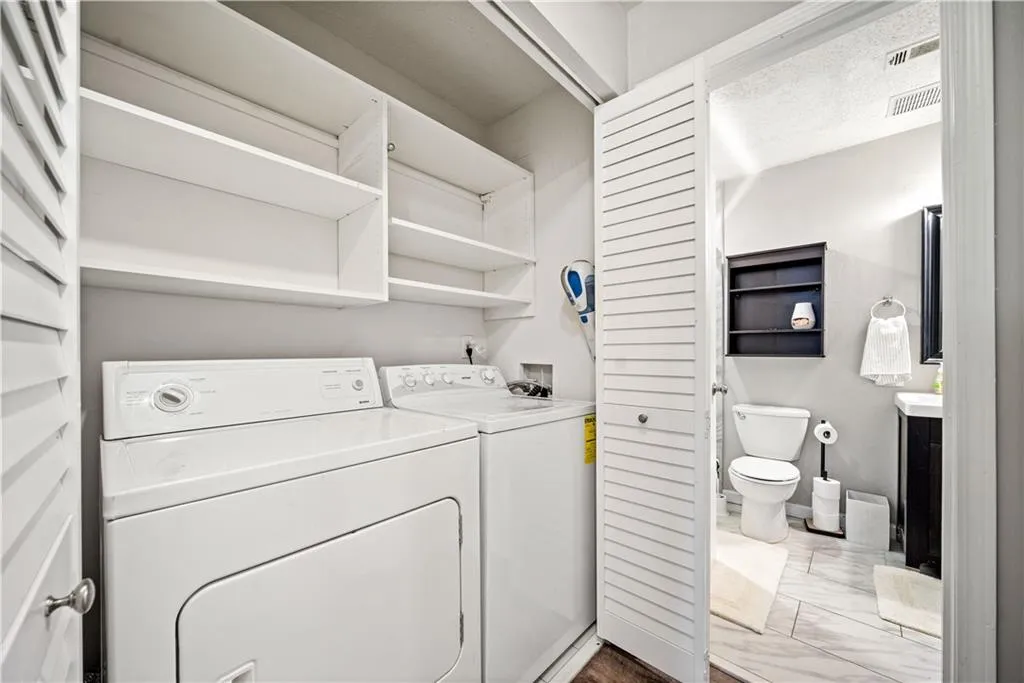 Laundry room featuring separate washer and dryer