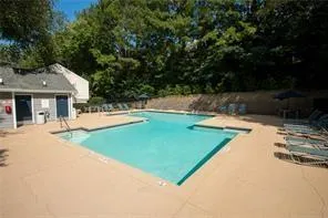 Community pool featuring a patio