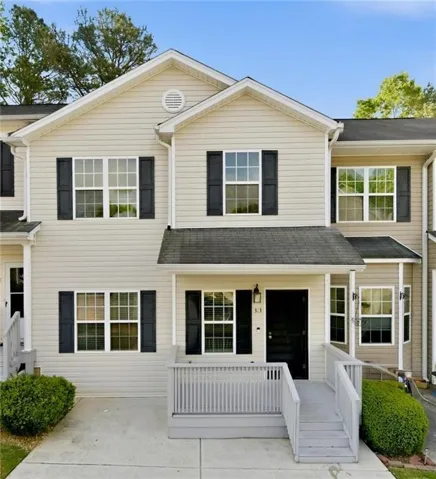Welcome to 313 Venture Path- Charming townhome with inviting curb appeal and covered front entry