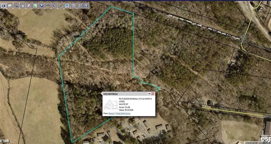Aerial map of property and surrounding area featuring property boundaries highlighted