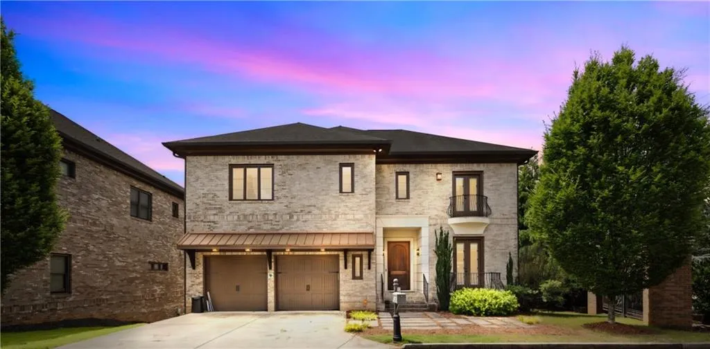 View of front facade featuring a garage