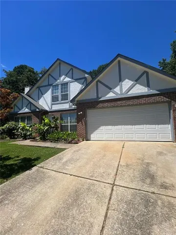 View of front facade featuring a garage
