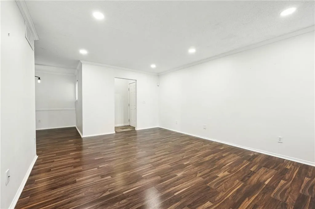 Recessed lighting and great wood plank flooring.
