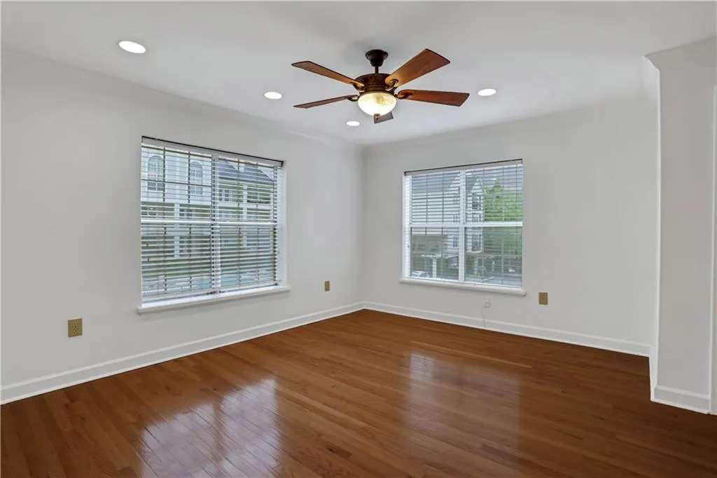 Unfurnished room with hardwood / wood-style floors, recessed lighting, a ceiling fan, and ornamental molding